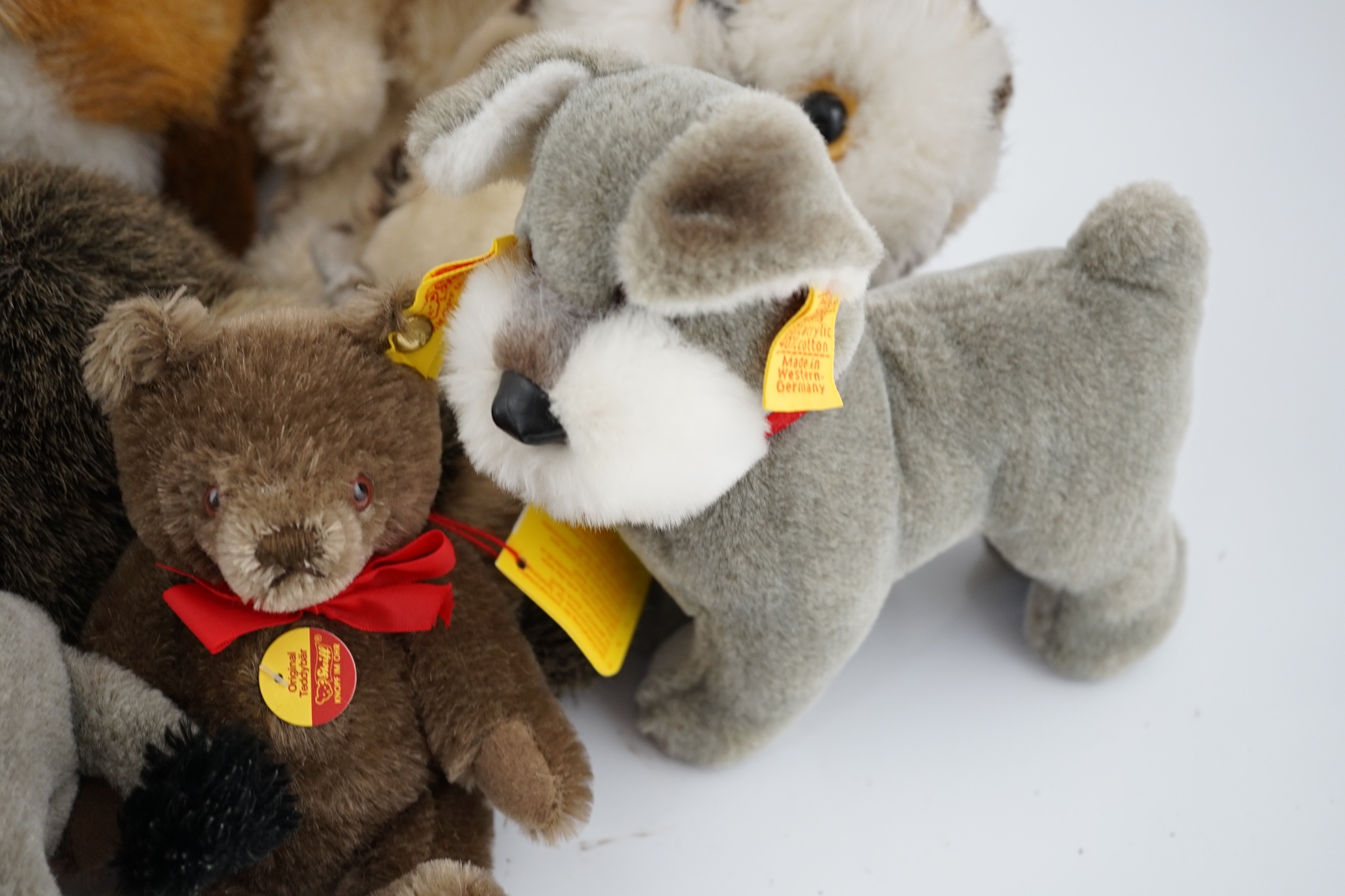 Nine assorted yellow tag Steiff animals, one Yorkshire Terrier, Steiff china plate, one yellow tag bear (12)